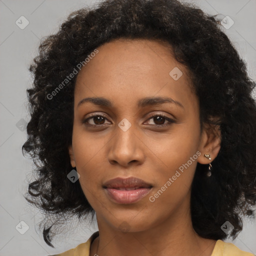 Joyful black young-adult female with medium  black hair and brown eyes