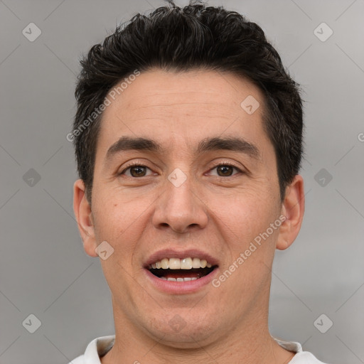 Joyful white adult male with short  brown hair and brown eyes