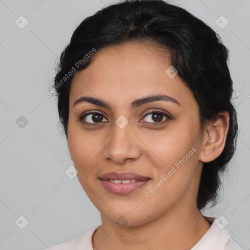 Joyful latino young-adult female with medium  brown hair and brown eyes