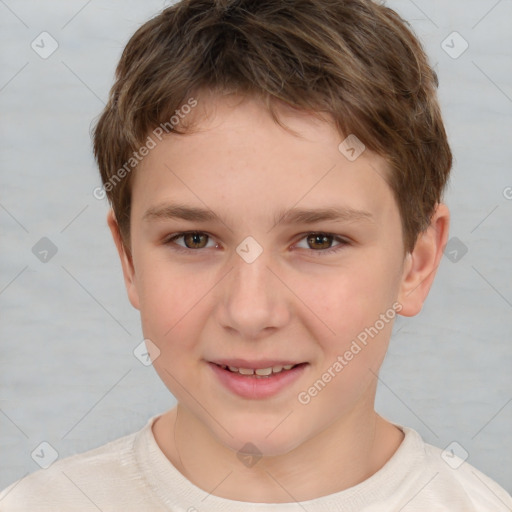 Joyful white child male with short  brown hair and brown eyes