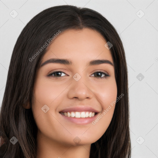 Joyful white young-adult female with long  black hair and brown eyes