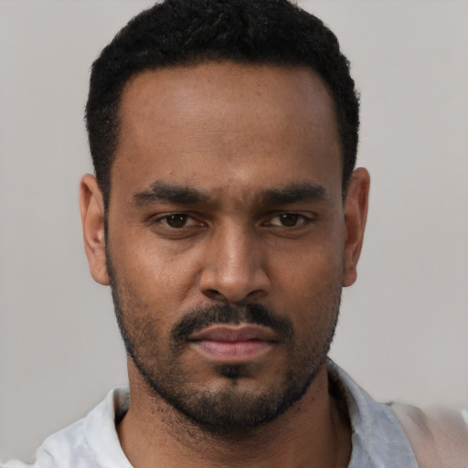 Neutral black young-adult male with short  black hair and brown eyes