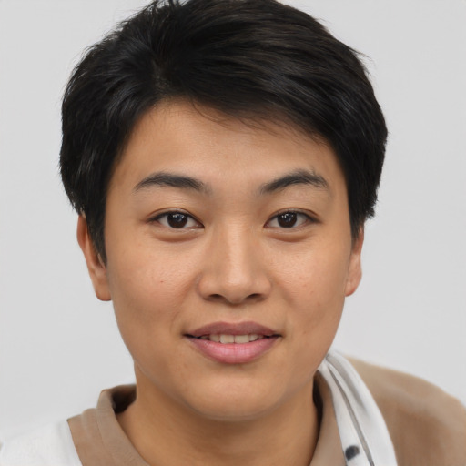 Joyful asian young-adult female with short  brown hair and brown eyes