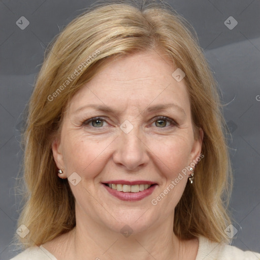 Joyful white adult female with medium  brown hair and grey eyes