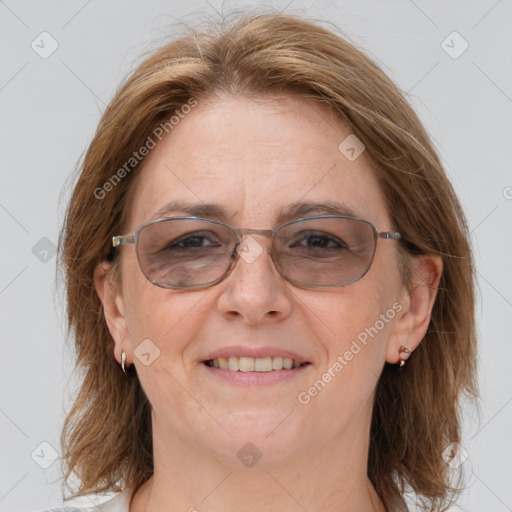 Joyful white adult female with medium  brown hair and grey eyes