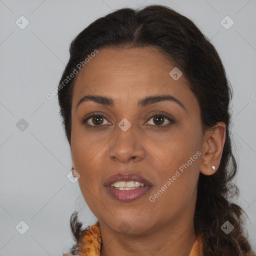 Joyful black adult female with medium  brown hair and brown eyes