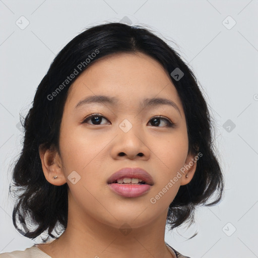 Joyful asian young-adult female with medium  black hair and brown eyes