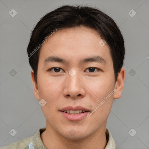 Joyful asian young-adult male with short  brown hair and brown eyes