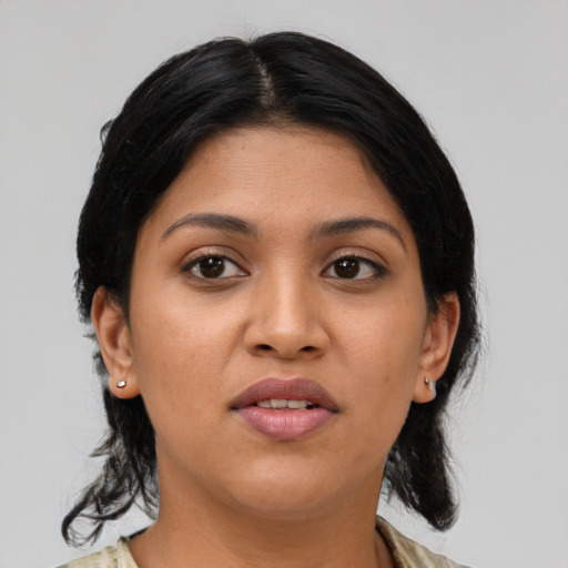 Joyful latino young-adult female with medium  black hair and brown eyes
