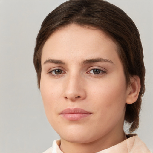 Neutral white young-adult female with short  brown hair and brown eyes