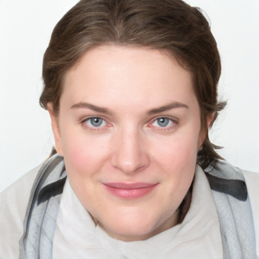 Joyful white young-adult female with medium  brown hair and blue eyes