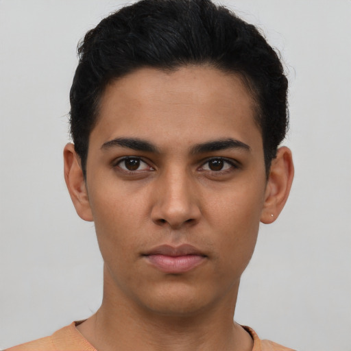 Neutral latino young-adult male with short  black hair and brown eyes