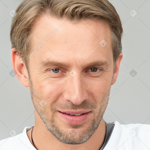 Joyful white adult male with short  brown hair and grey eyes