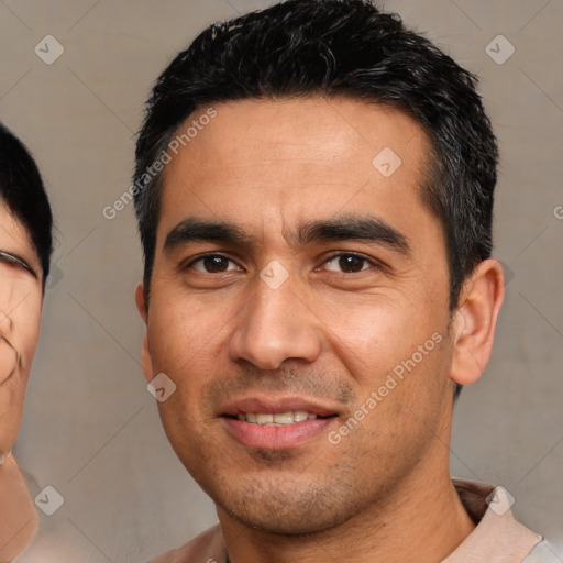 Joyful asian young-adult male with short  black hair and brown eyes