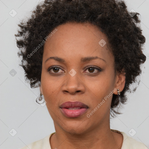 Joyful black adult female with short  brown hair and brown eyes