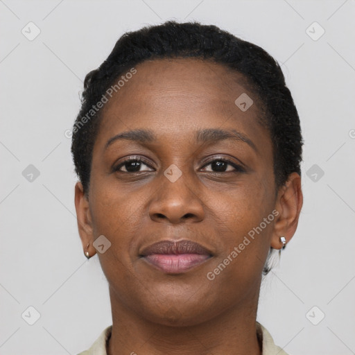 Joyful black young-adult female with short  brown hair and brown eyes