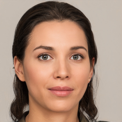 Joyful white young-adult female with medium  brown hair and brown eyes