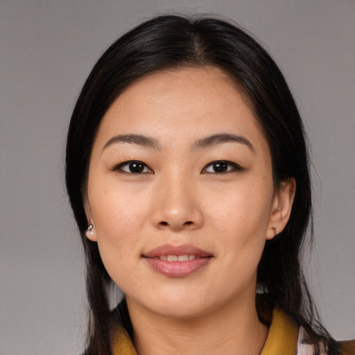 Joyful asian young-adult female with medium  black hair and brown eyes
