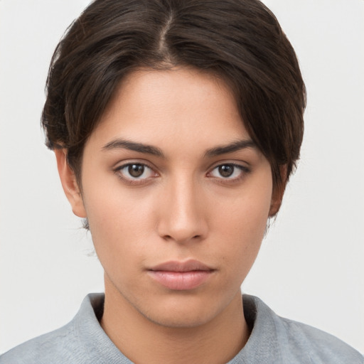 Neutral white young-adult female with short  brown hair and brown eyes