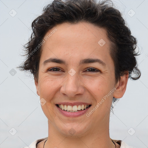 Joyful white adult female with short  brown hair and brown eyes