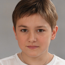 Joyful white child male with short  brown hair and brown eyes