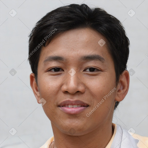 Joyful asian young-adult male with short  brown hair and brown eyes