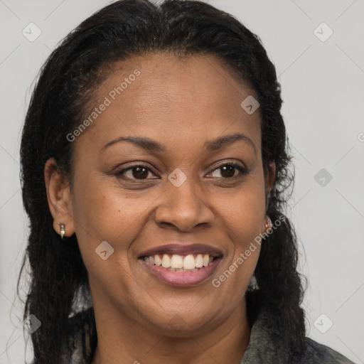 Joyful black adult female with medium  brown hair and brown eyes