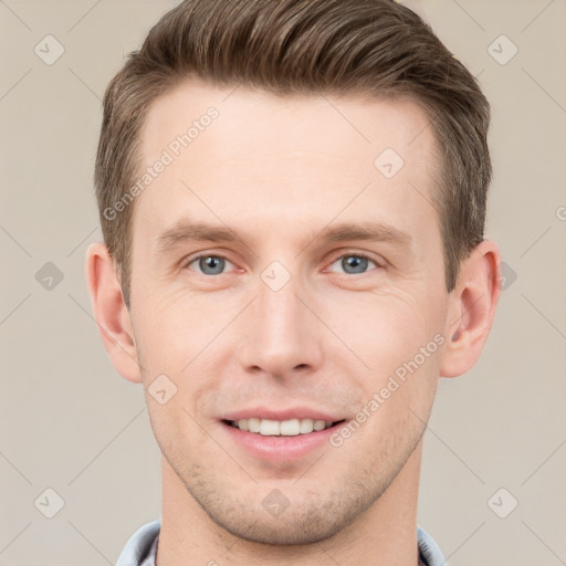 Joyful white young-adult male with short  brown hair and grey eyes