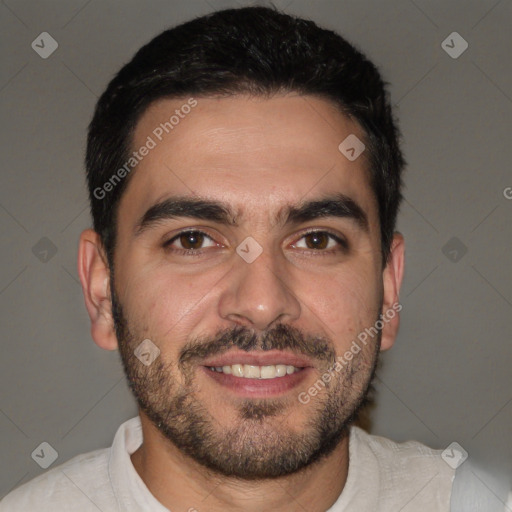 Joyful white young-adult male with short  black hair and brown eyes