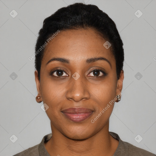 Joyful black young-adult female with short  black hair and brown eyes