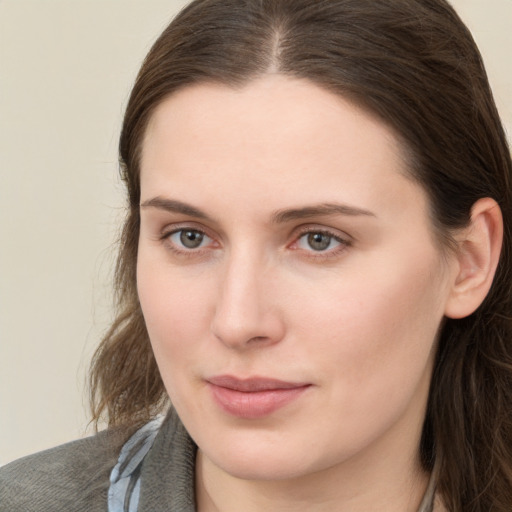 Neutral white young-adult female with long  brown hair and grey eyes