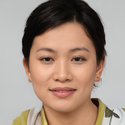 Joyful asian young-adult female with medium  brown hair and brown eyes