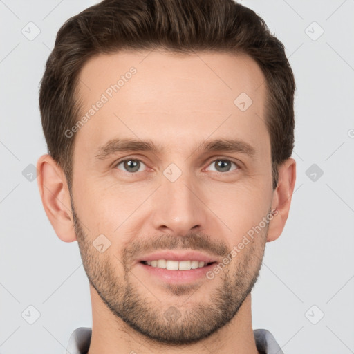 Joyful white young-adult male with short  brown hair and grey eyes