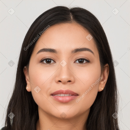 Joyful latino young-adult female with long  brown hair and brown eyes