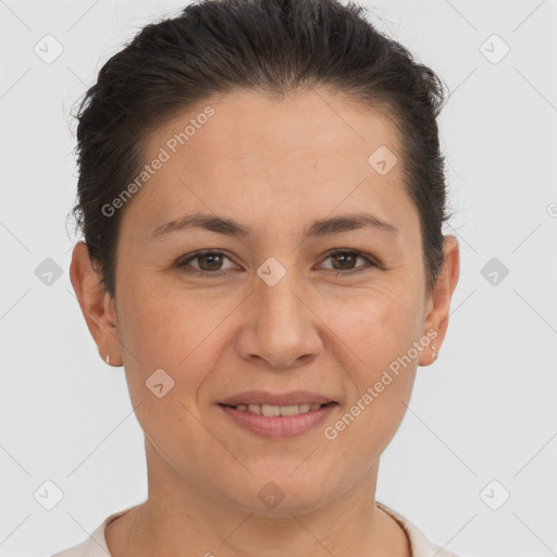 Joyful white adult female with short  brown hair and brown eyes