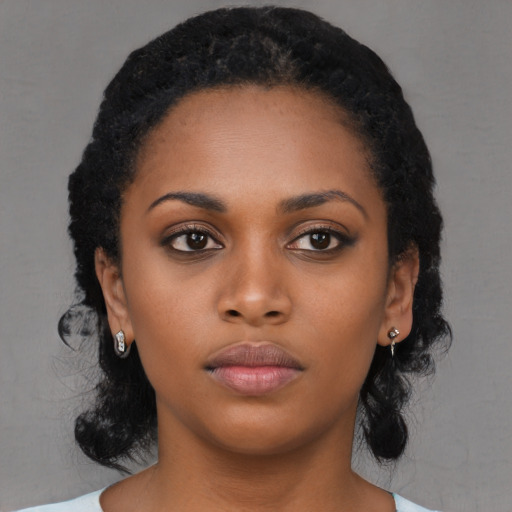 Neutral black young-adult female with long  black hair and brown eyes