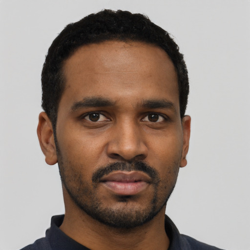 Neutral black young-adult male with short  black hair and brown eyes