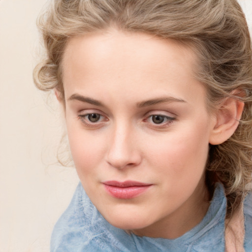 Joyful white child female with medium  brown hair and blue eyes