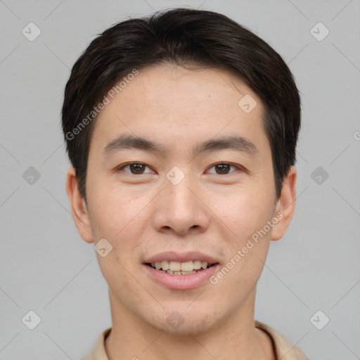 Joyful asian young-adult male with short  brown hair and brown eyes