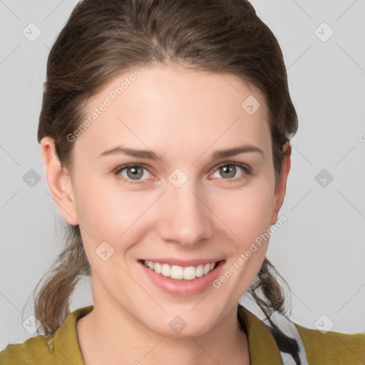 Joyful white young-adult female with medium  brown hair and grey eyes