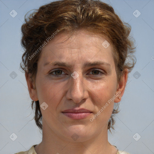 Joyful white adult female with medium  brown hair and blue eyes