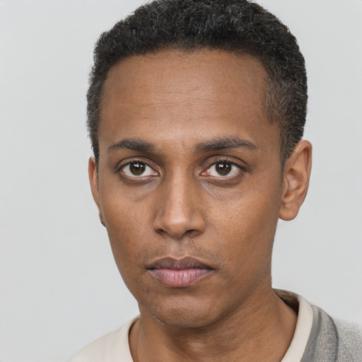 Neutral black young-adult male with short  black hair and brown eyes