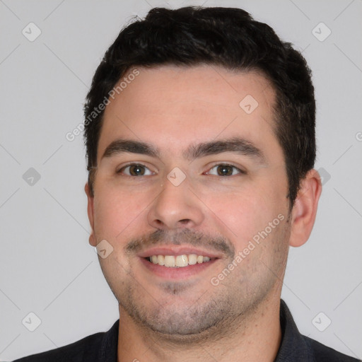 Joyful white young-adult male with short  black hair and brown eyes