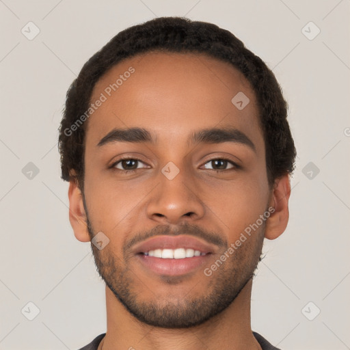 Joyful latino young-adult male with short  brown hair and brown eyes