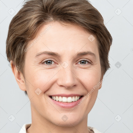 Joyful white young-adult female with short  brown hair and grey eyes