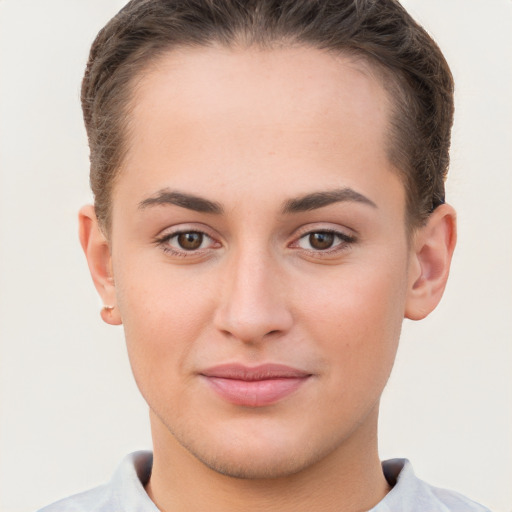 Joyful white young-adult female with short  brown hair and brown eyes