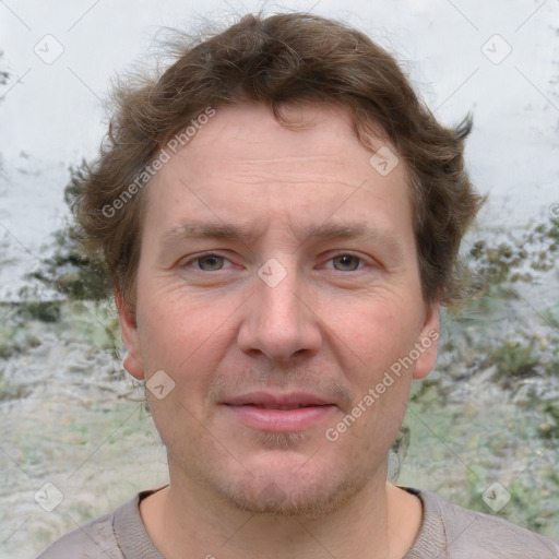 Joyful white adult male with short  brown hair and grey eyes