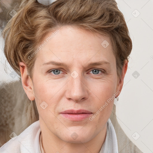 Joyful white adult female with short  brown hair and grey eyes