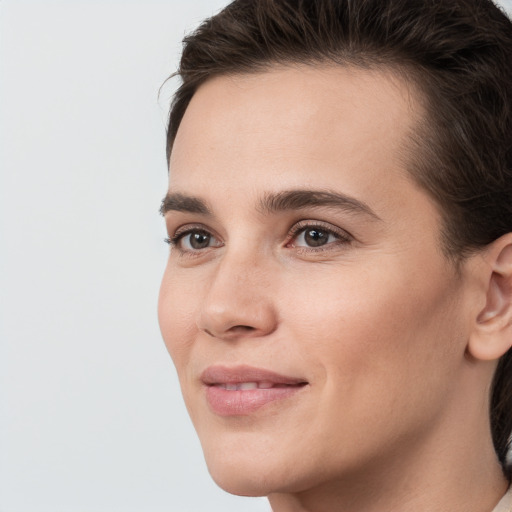 Joyful white young-adult female with medium  brown hair and brown eyes