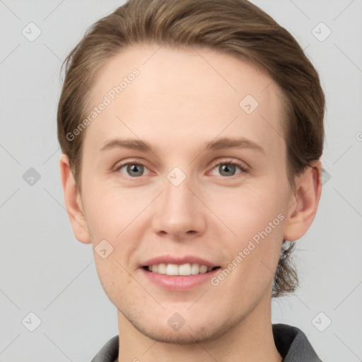 Joyful white young-adult female with short  brown hair and grey eyes